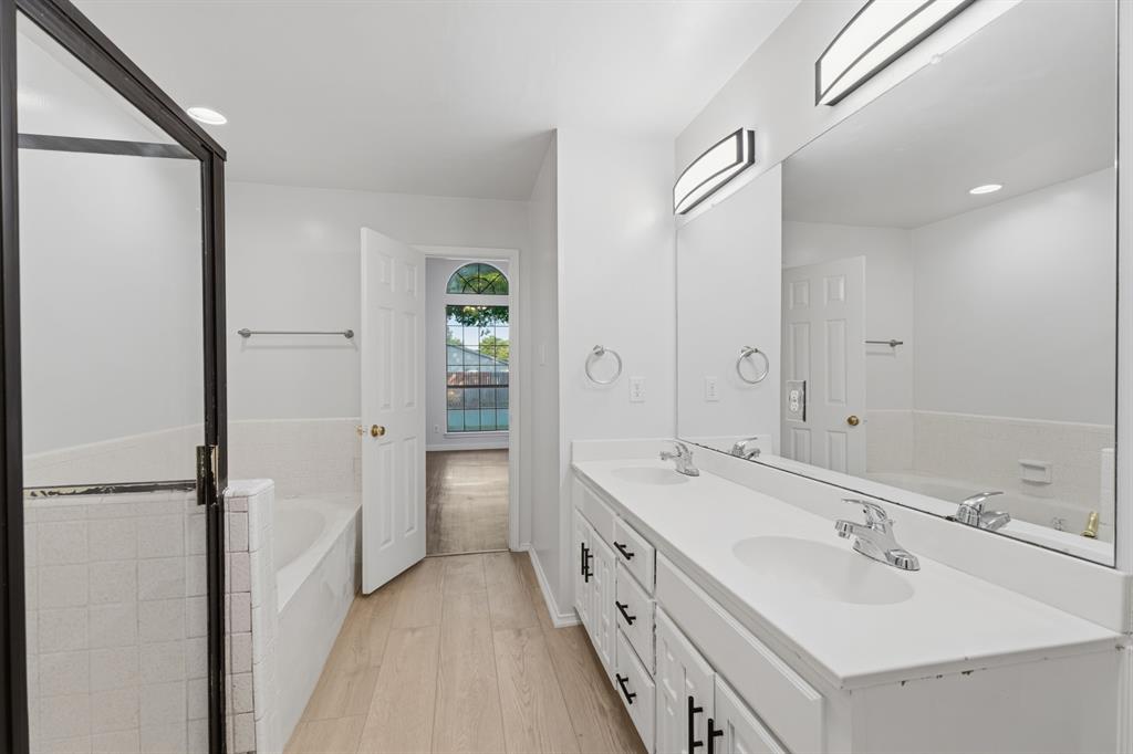 3721 Smartt Street Rowlett, TX 75088 - Photo 8 of 27 a bathroom with a double vanity sink mirror and double
