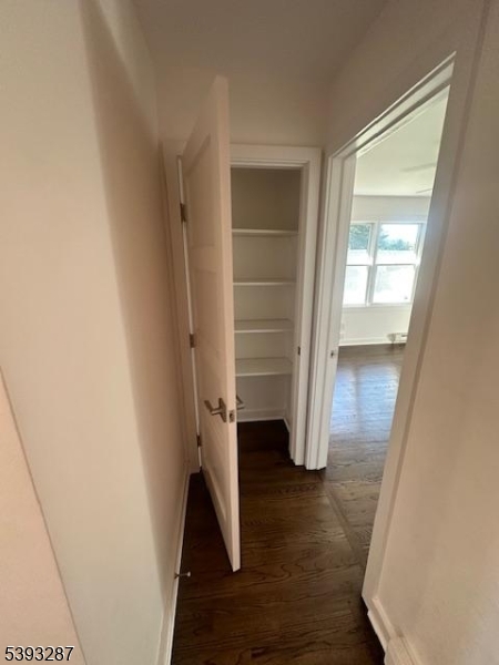 56 Buena Vista Road, Unit 1 Cedar Grove, NJ 07009 - Photo 11 of 16 a view of walk in closet with empty racks