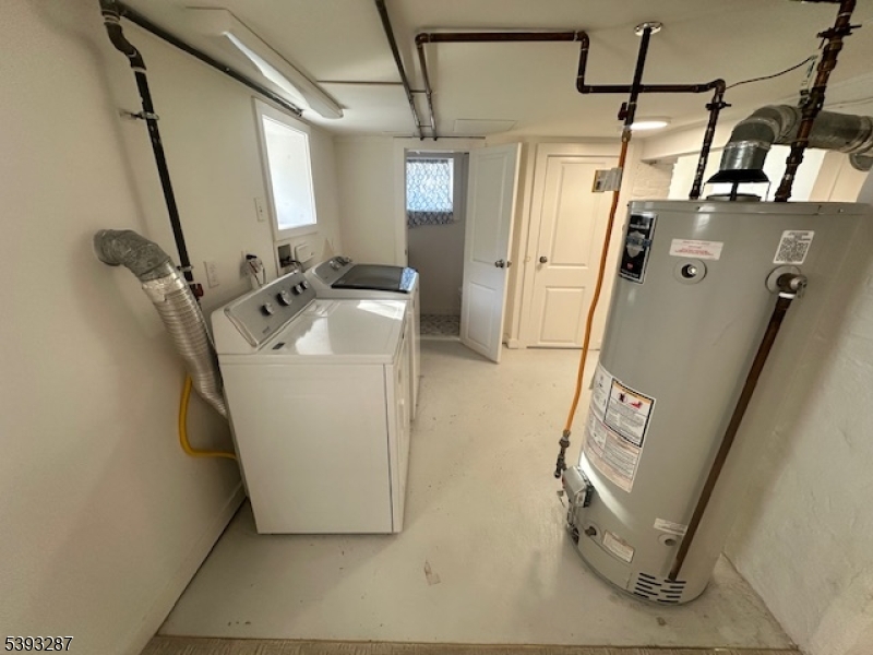 56 Buena Vista Road, Unit 1 Cedar Grove, NJ 07009 - Photo 13 of 16 a utility room with a washer and dryer