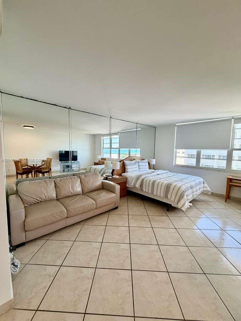 100 Lincoln Road, Unit 731 Miami Beach, FL 33139 - Photo 4 of 12 a living room with couches and large kitchen view