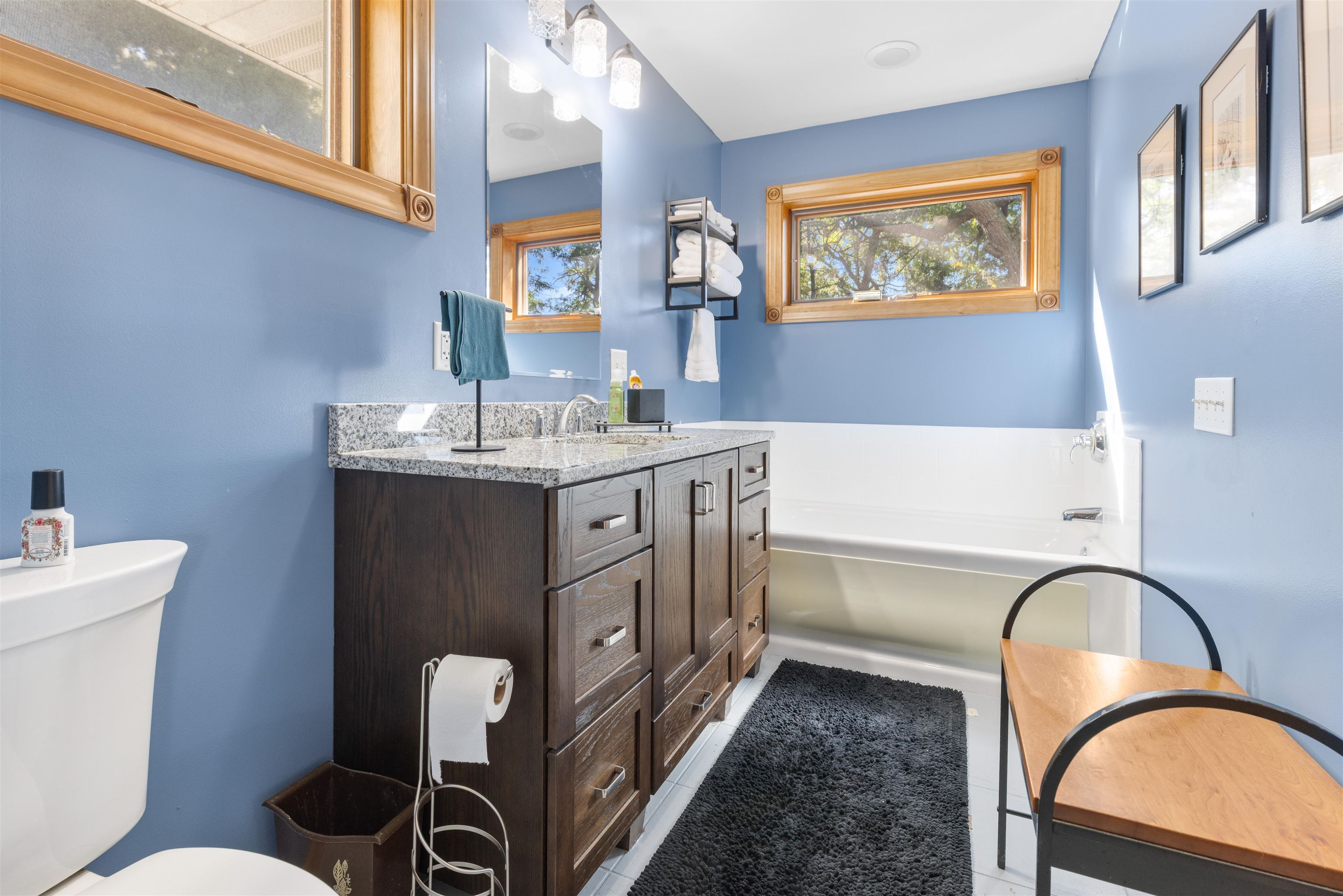 1610 South Turtle Town Hall Road Beloit, WI 53511 - Photo 11 of 50 a bathroom with a granite countertop toilet a sink and a mirror