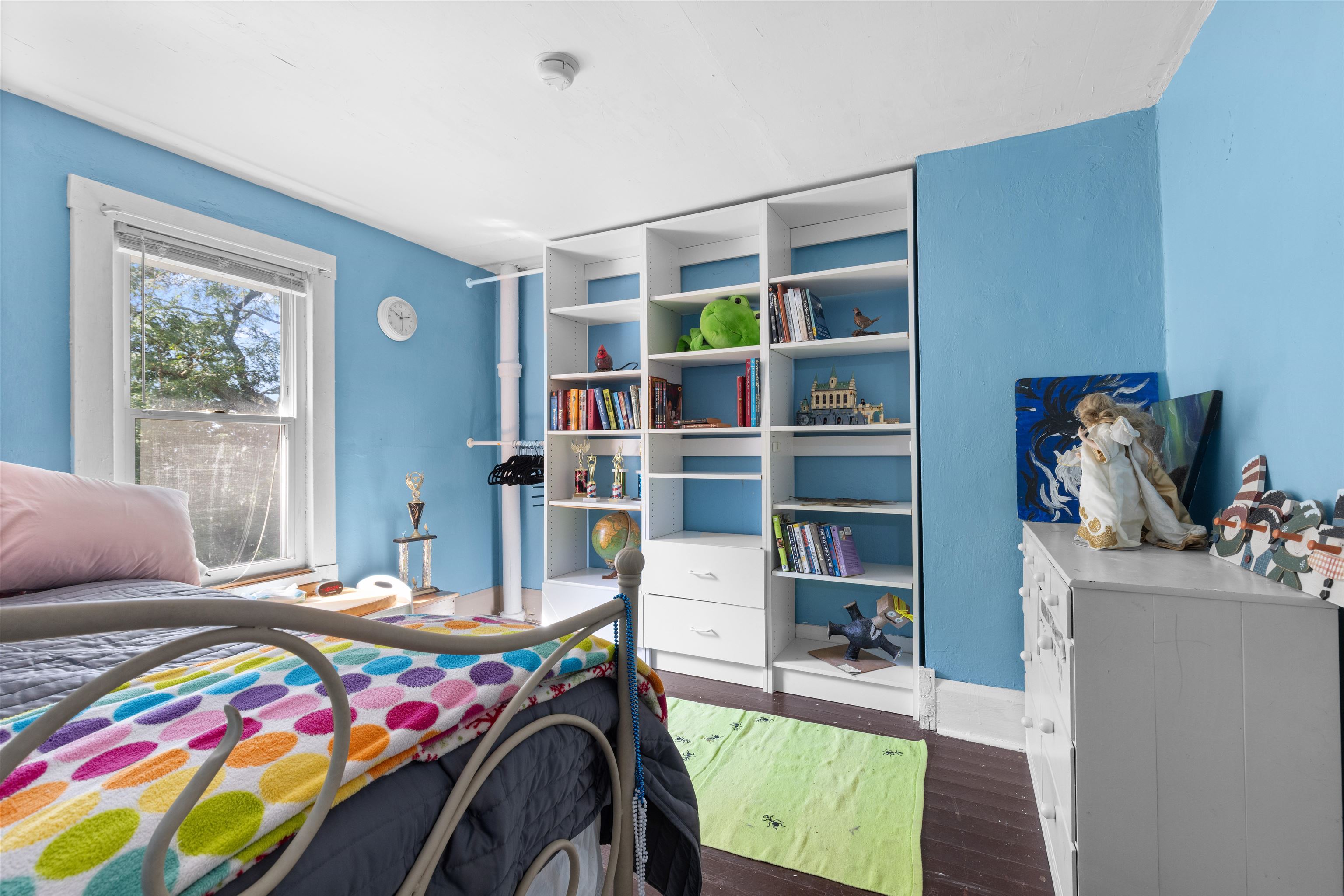 1610 South Turtle Town Hall Road Beloit, WI 53511 - Photo 21 of 50 a bedroom with a bed and a wooden floor