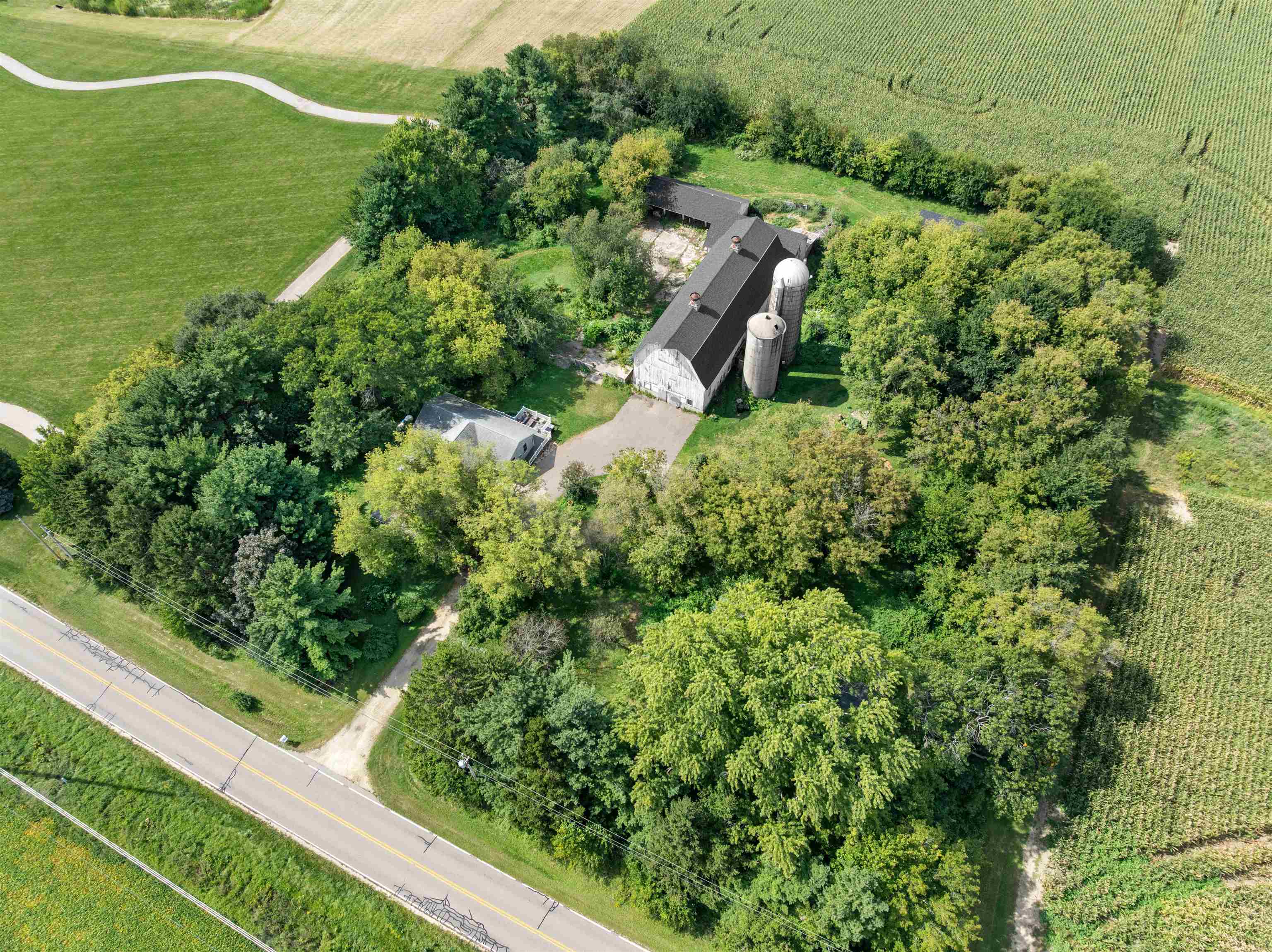 1610 South Turtle Town Hall Road Beloit, WI 53511 - Photo 36 of 50 an aerial view of residential house with outdoor space and trees all around