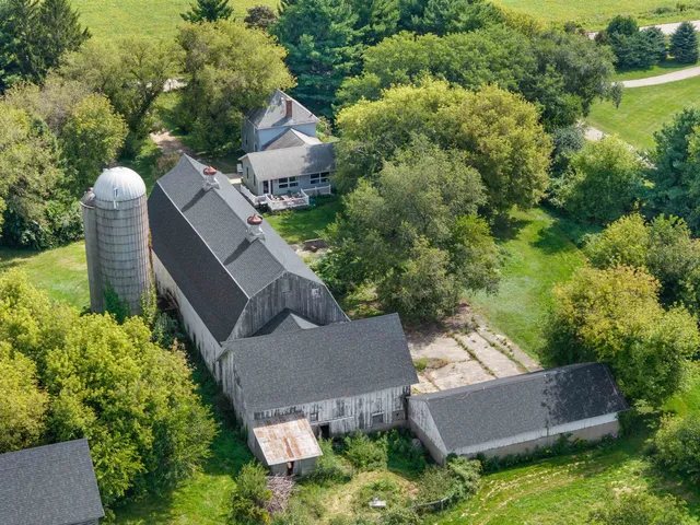 an aerial view of a houses with a lake view