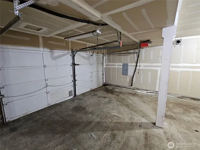 a view of a backyard with wooden fence