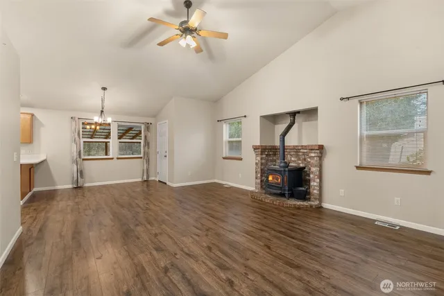 a kitchen with stainless steel appliances kitchen island granite countertop a stove and a sink