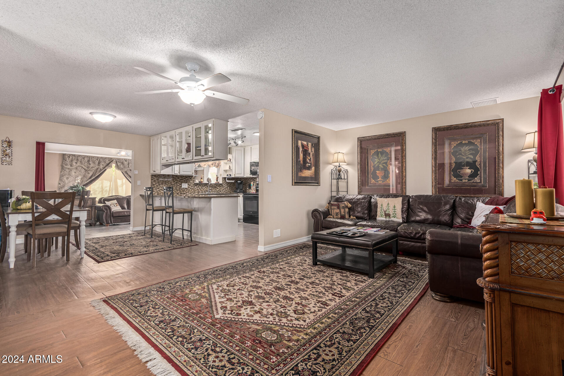 849 North 67th Place Mesa, AZ 85205 - Photo 1 of 47 a living room with furniture and wooden floor