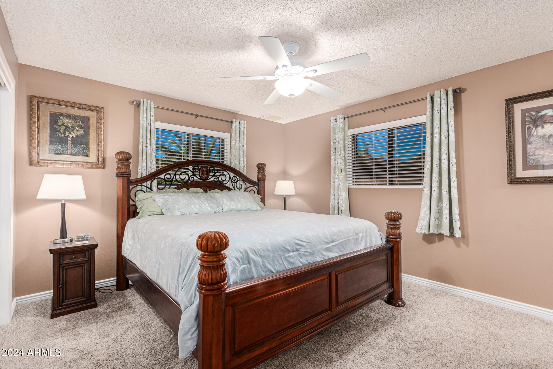 849 North 67th Place Mesa, AZ 85205 - Photo 14 of 47 a bedroom with a bed and a chandelier