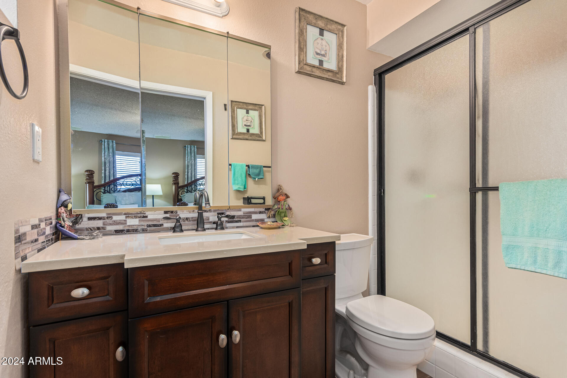 849 North 67th Place Mesa, AZ 85205 - Photo 17 of 47 a bathroom with a sink vanity mirror and toilet