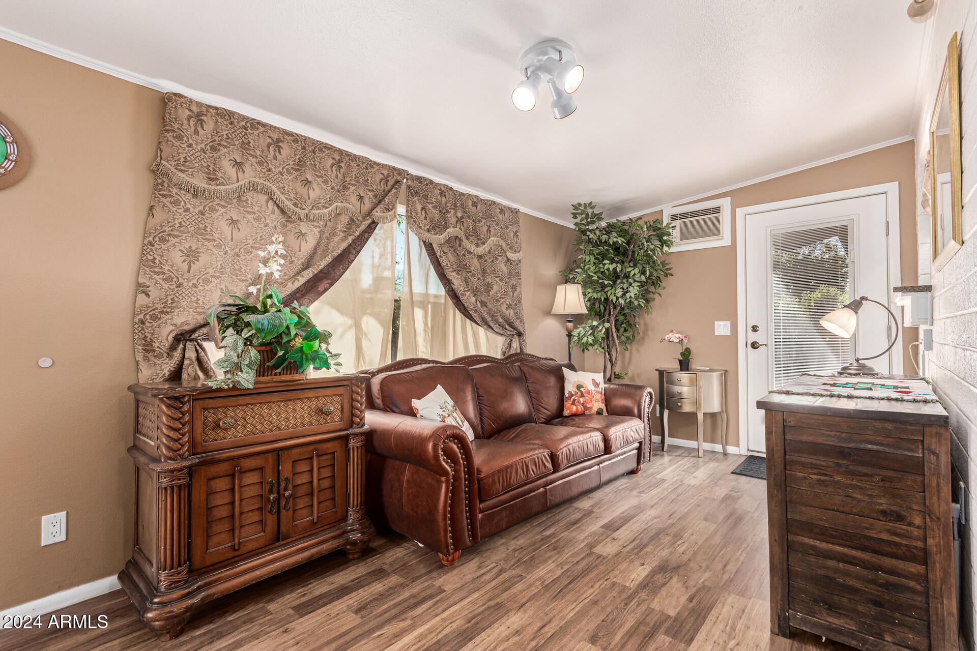 849 North 67th Place Mesa, AZ 85205 - Photo 22 of 47 a living room with furniture and a chandelier