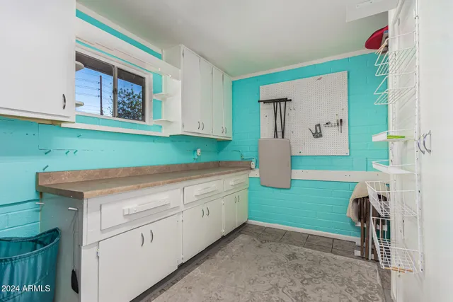a kitchen with a sink and cabinets