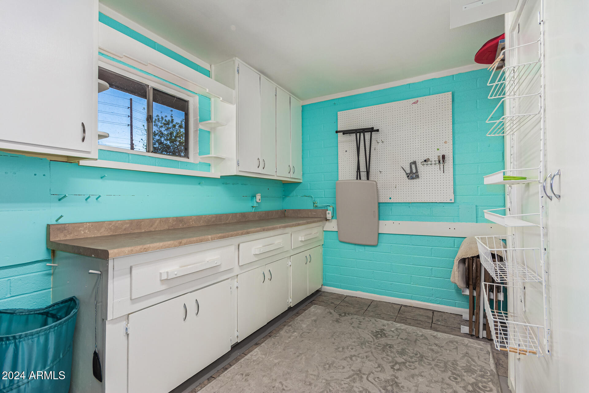 849 North 67th Place Mesa, AZ 85205 - Photo 23 of 47 a kitchen with a sink and cabinets