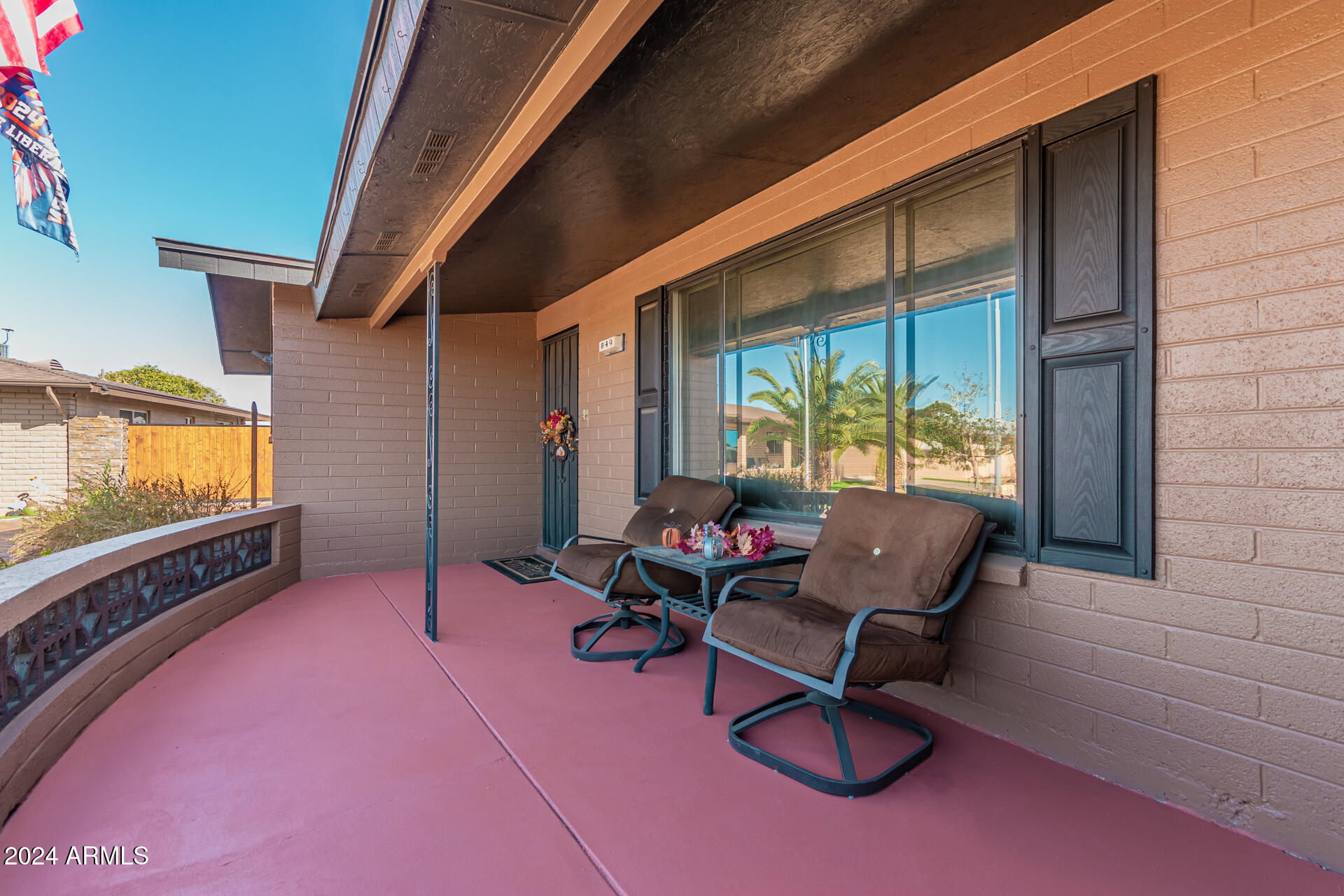 849 North 67th Place Mesa, AZ 85205 - Photo 27 of 47 a living room with furniture and a flat screen tv