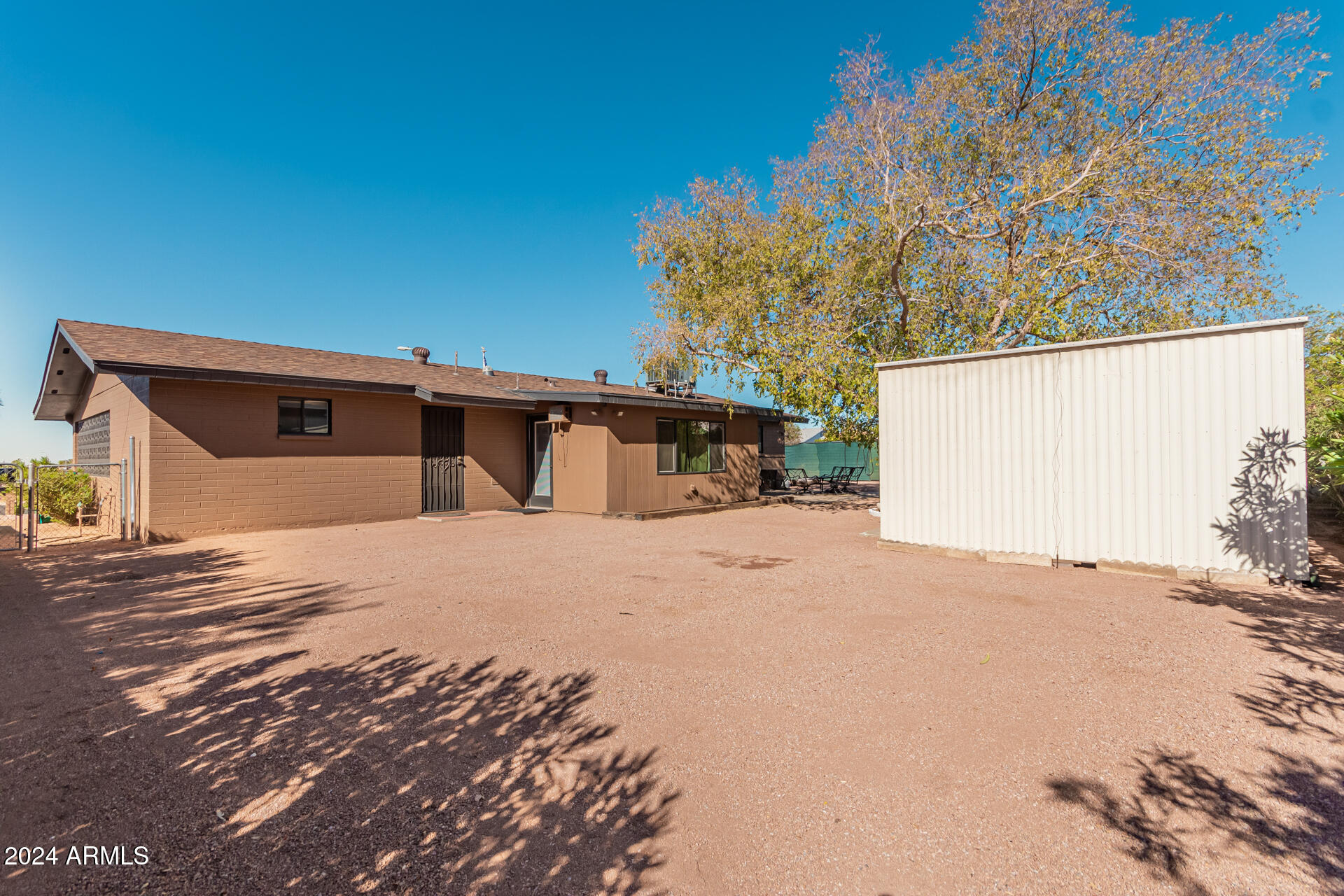 849 North 67th Place Mesa, AZ 85205 - Photo 34 of 47 a house with trees in front of it
