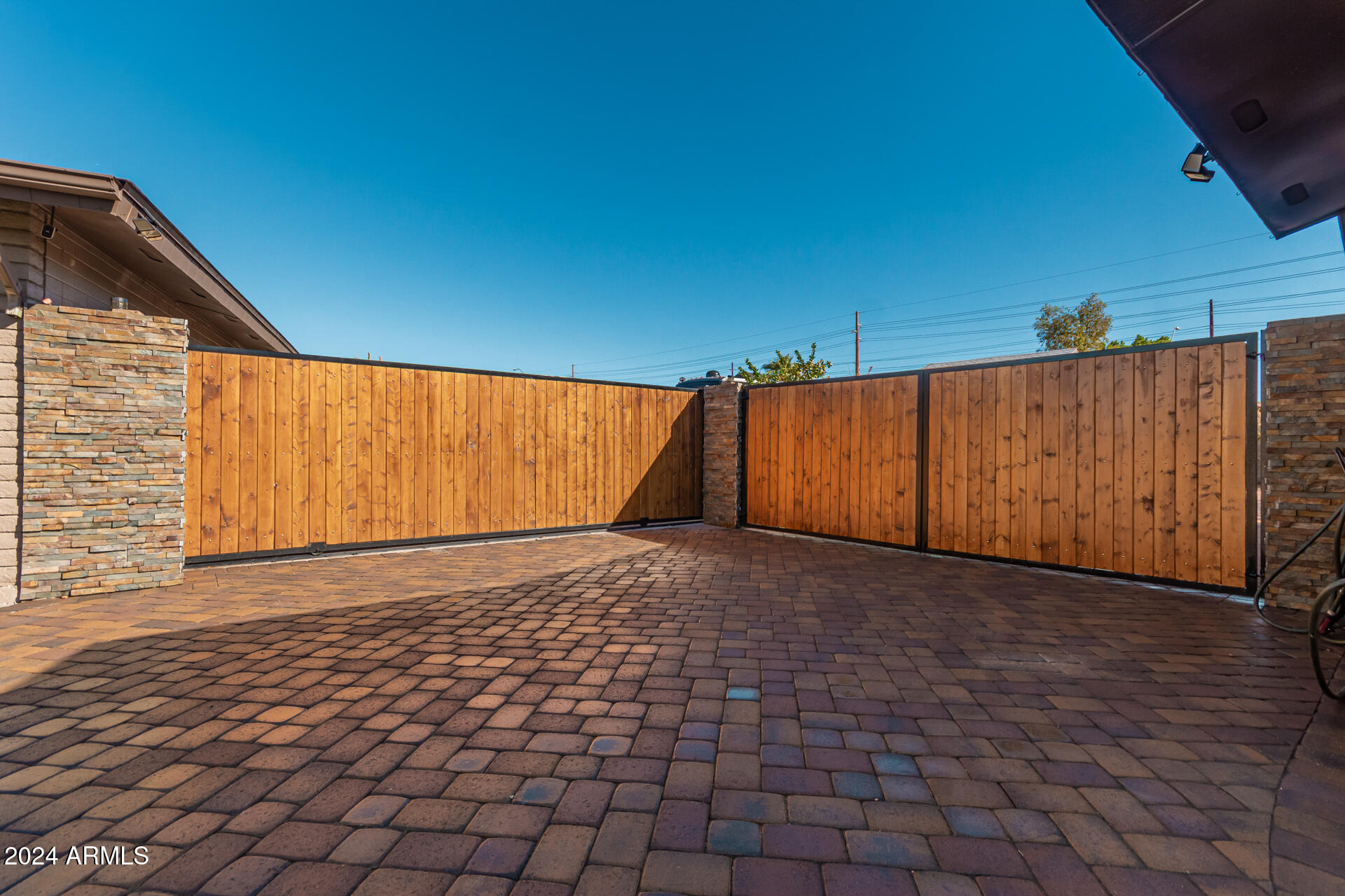849 North 67th Place Mesa, AZ 85205 - Photo 37 of 47 a view of an empty room with a window and wooden floor