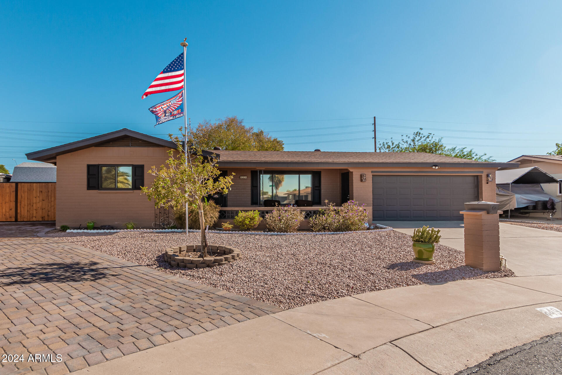 849 North 67th Place Mesa, AZ 85205 - Photo 38 of 47 a front view of a house with a garden
