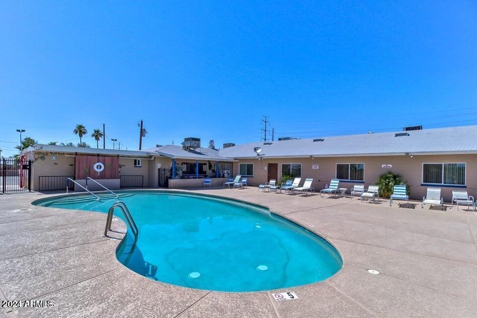 849 North 67th Place Mesa, AZ 85205 - Photo 43 of 47 a view of a swimming pool with sitting area