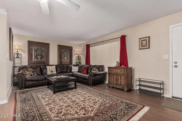 a living room with furniture and a rug