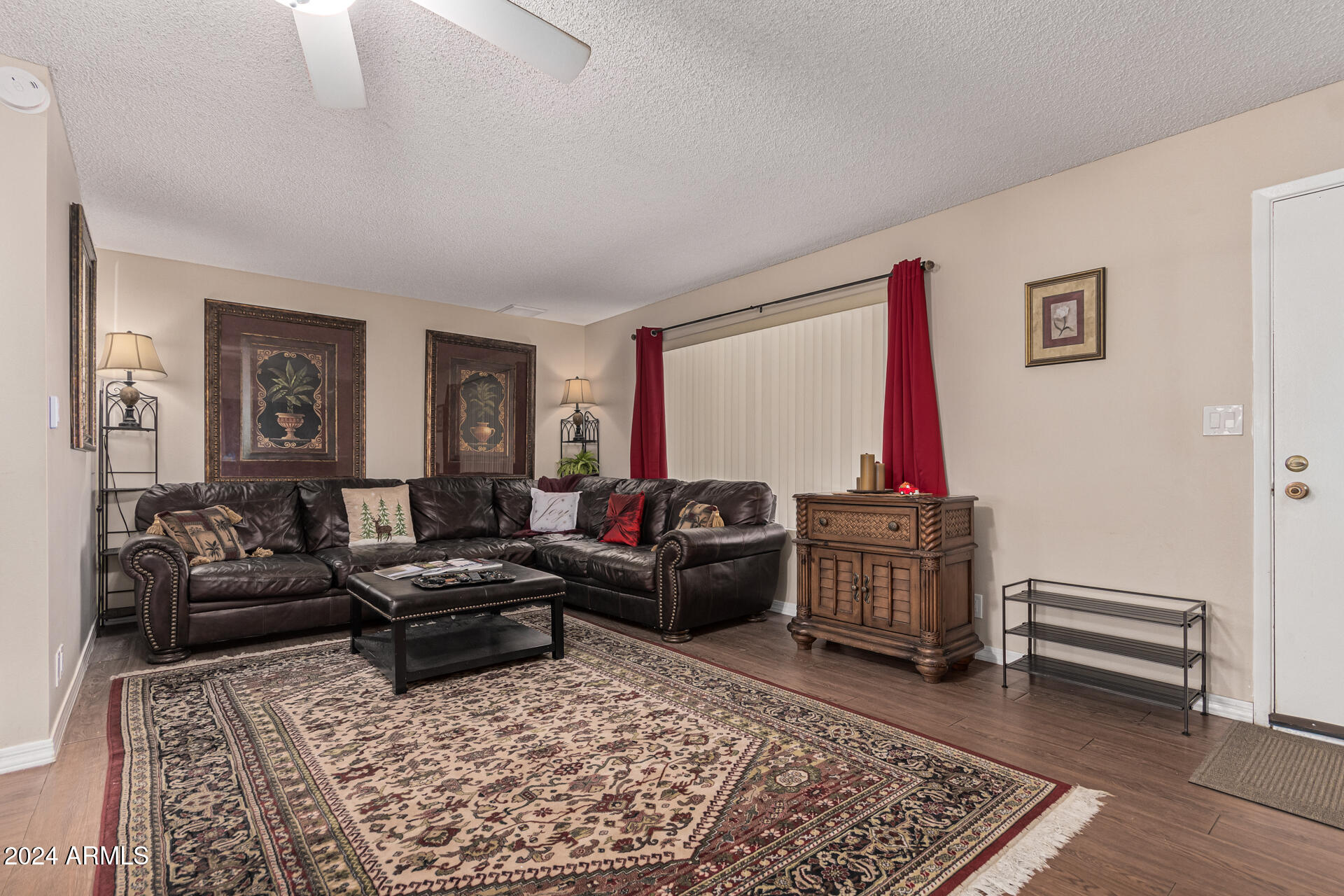 849 North 67th Place Mesa, AZ 85205 - Photo 5 of 47 a living room with furniture and a rug