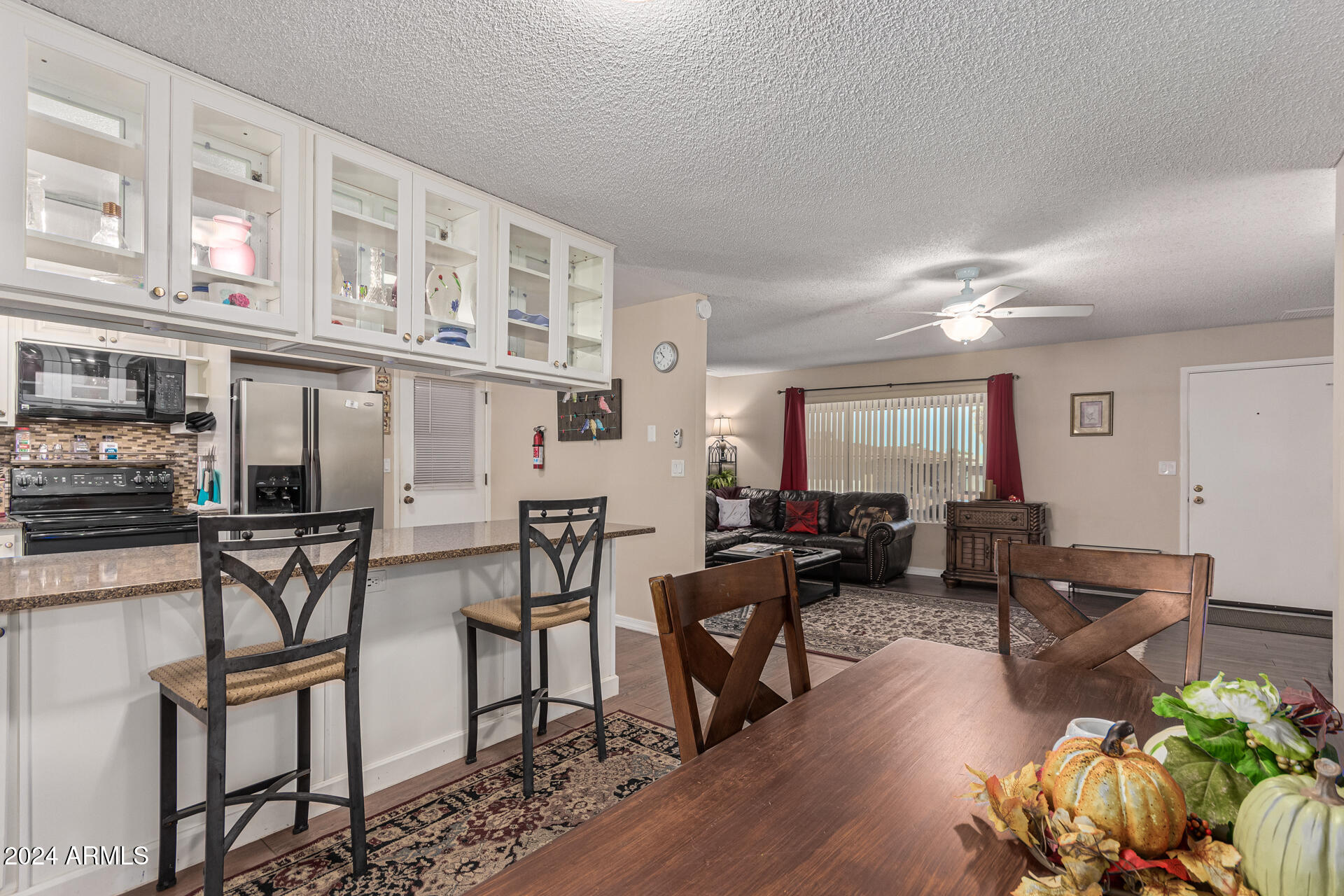 849 North 67th Place Mesa, AZ 85205 - Photo 8 of 47 a living room with fireplace furniture and a wooden floor