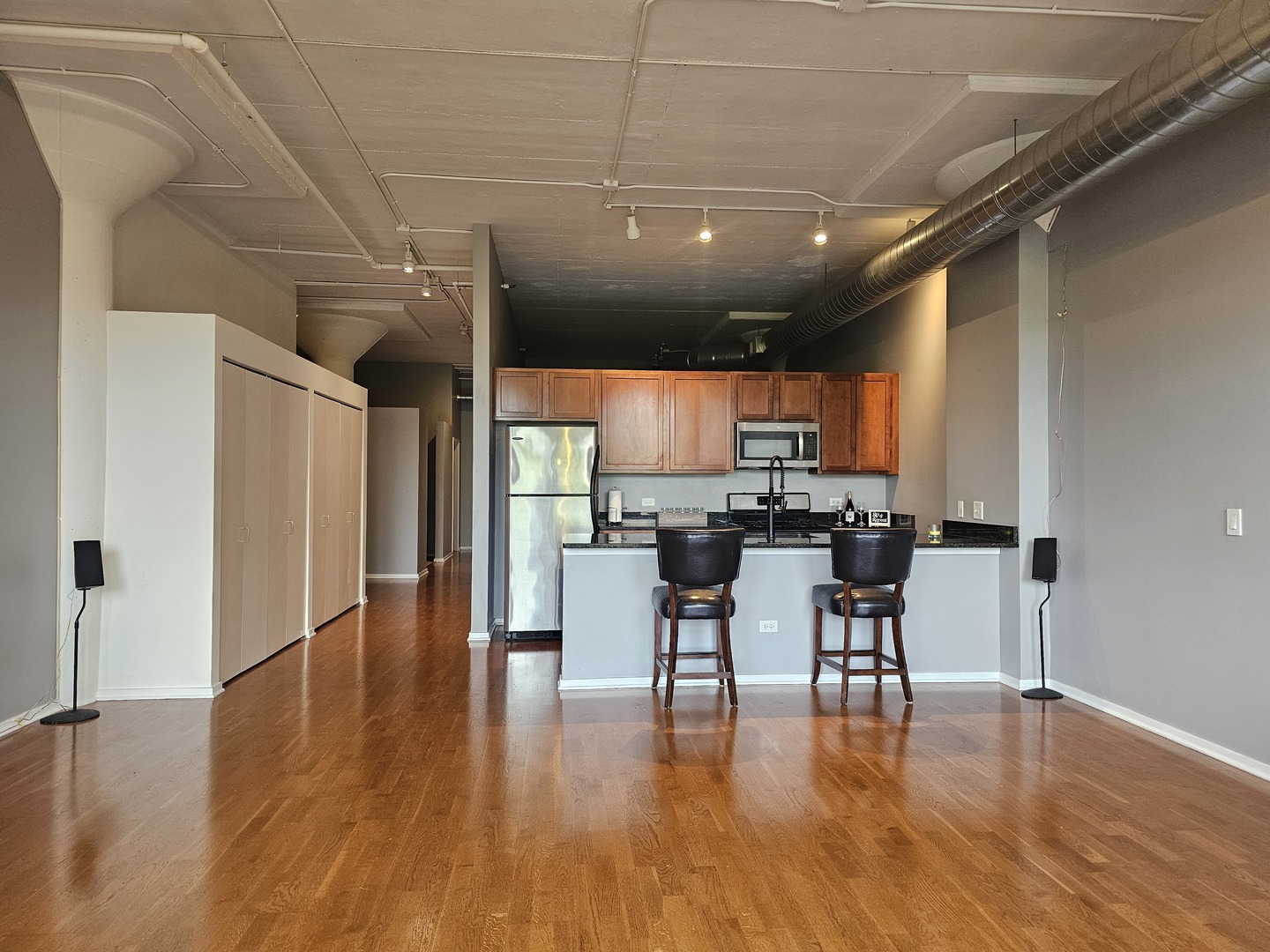 2323 West Pershing Road, Unit 230 Chicago, IL 60609 - Photo 10 of 30 a view of a dining room with furniture and wooden floor
