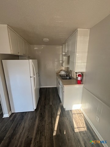 613 Stringer Street, Unit 4 Killeen, TX 76541 - Photo 4 of 7 a view of kitchen with wooden floor and cabinets
