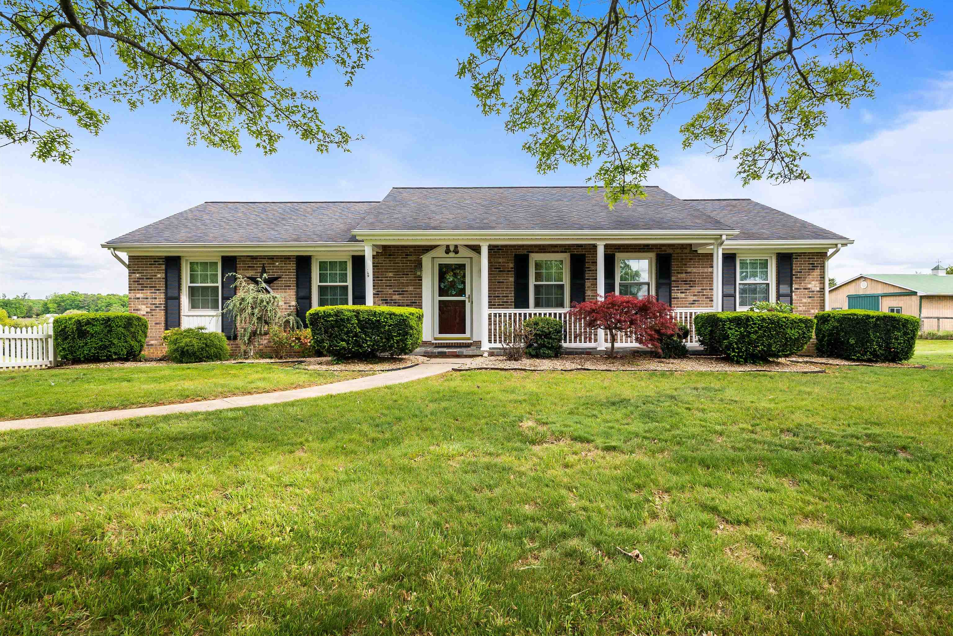 816 Todd Road Mount Sidney, VA 24467 - Photo 1 of 66 a front view of a house with garden