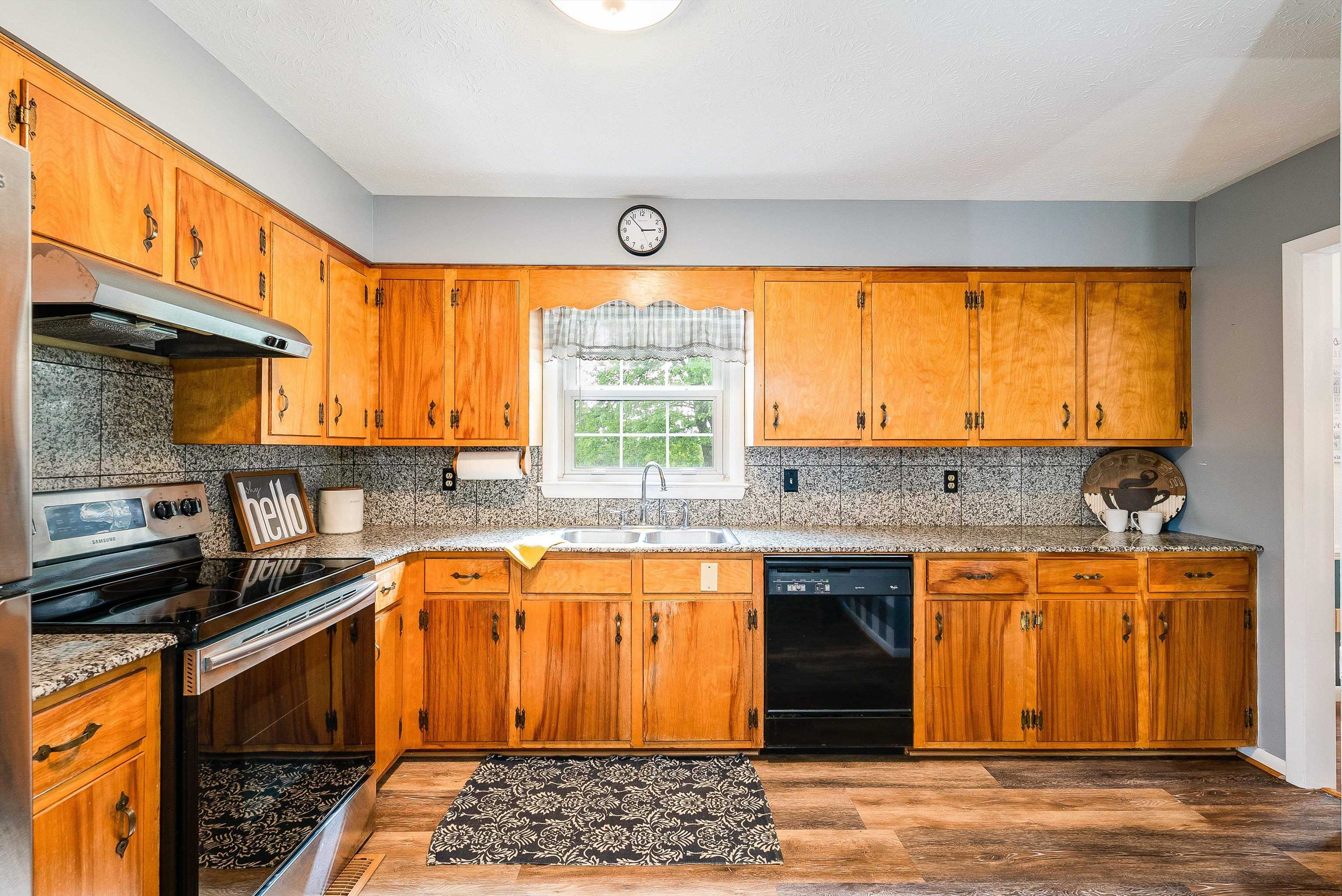 816 Todd Road Mount Sidney, VA 24467 - Photo 20 of 66 a kitchen with stainless steel appliances granite countertop a stove and a refrigerator