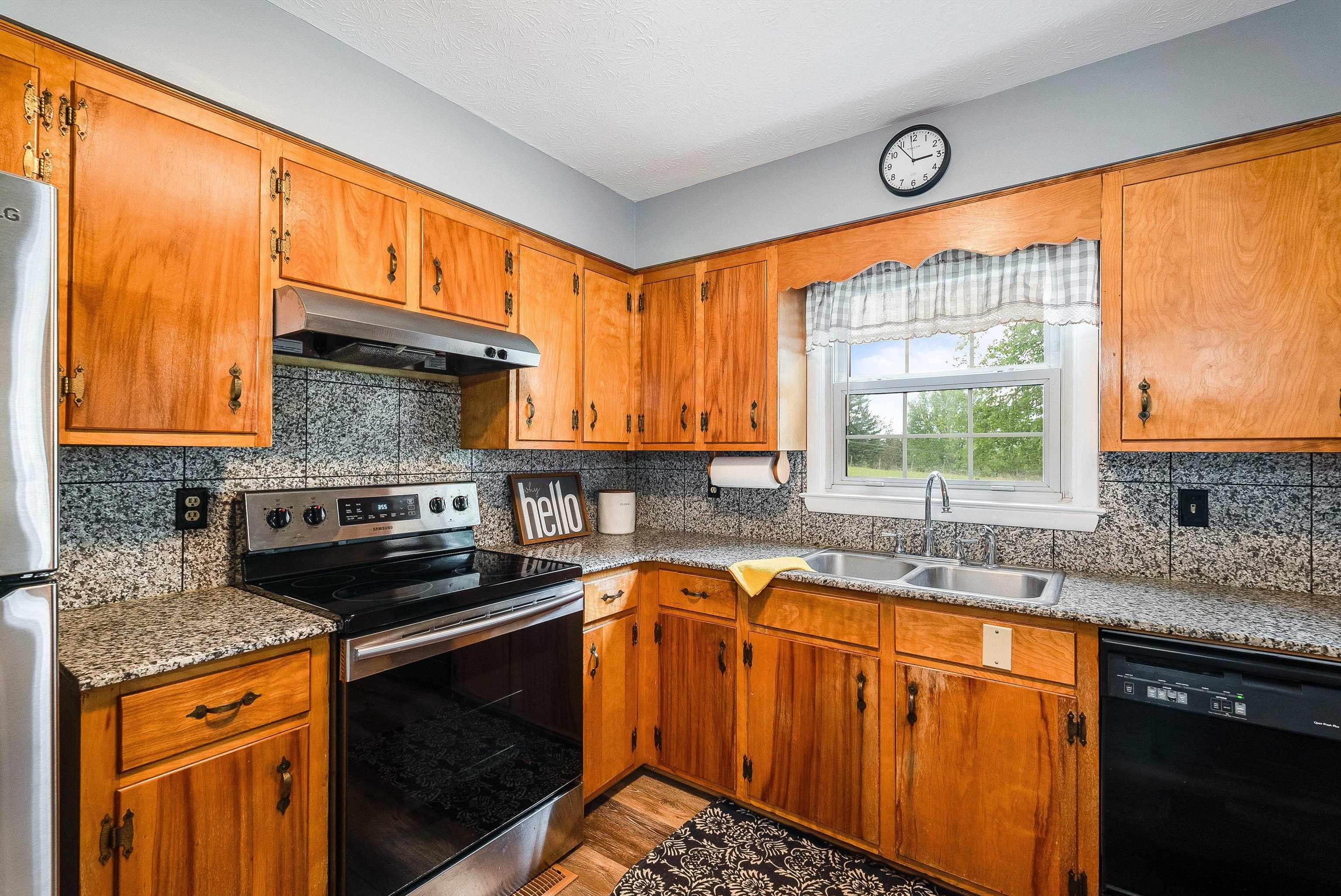 816 Todd Road Mount Sidney, VA 24467 - Photo 21 of 66 a kitchen with stainless steel appliances a sink stove and cabinets
