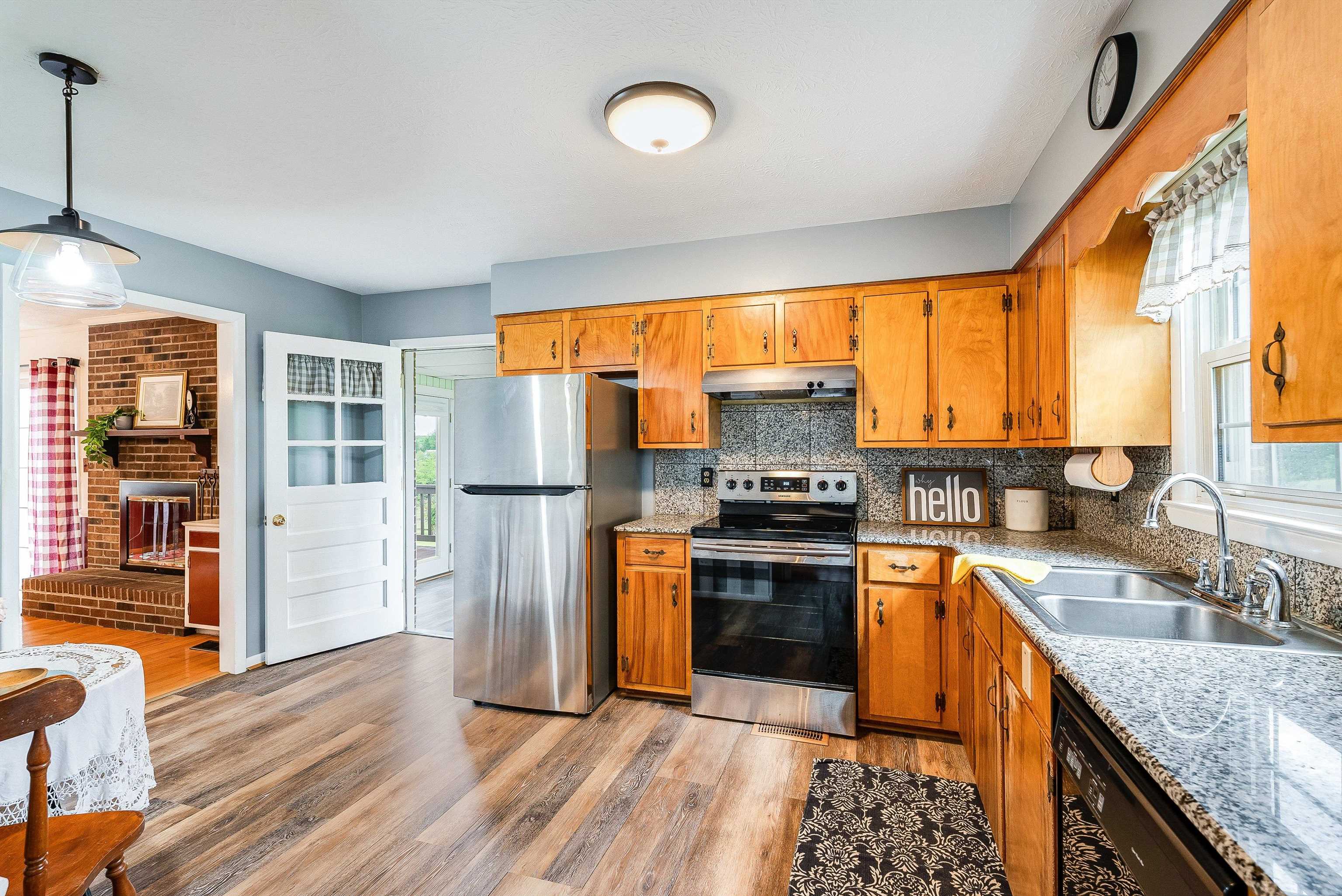 816 Todd Road Mount Sidney, VA 24467 - Photo 22 of 66 a kitchen with stainless steel appliances granite countertop a sink stove and refrigerator