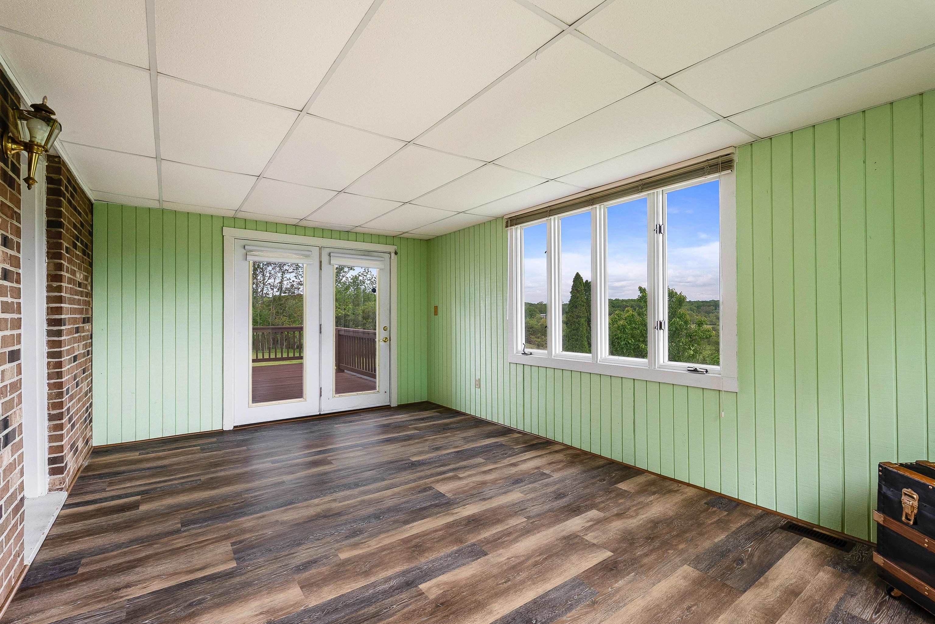 816 Todd Road Mount Sidney, VA 24467 - Photo 25 of 66 a view of an empty room with glass door and wooden floor