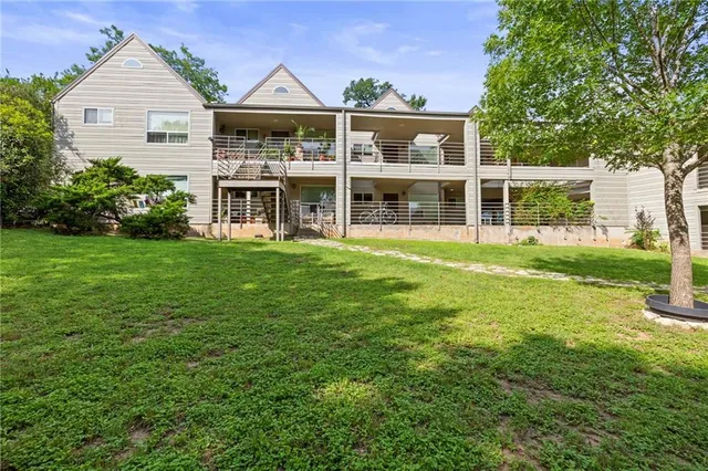 an aerial view of a house with yard and outdoor seating