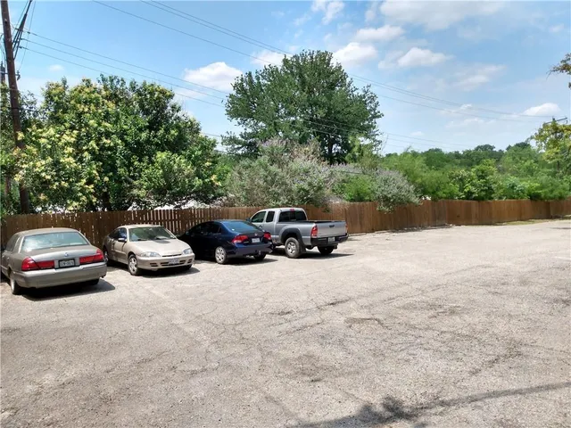 a view of outdoor space with deck and trees