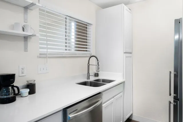 a kitchen with a sink and a window