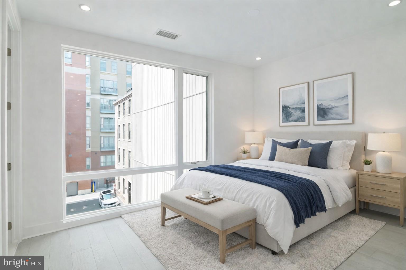 142 South Front Street Philadelphia, PA 19106 - Photo 26 of 36 a spacious bedroom with a bed and a large window