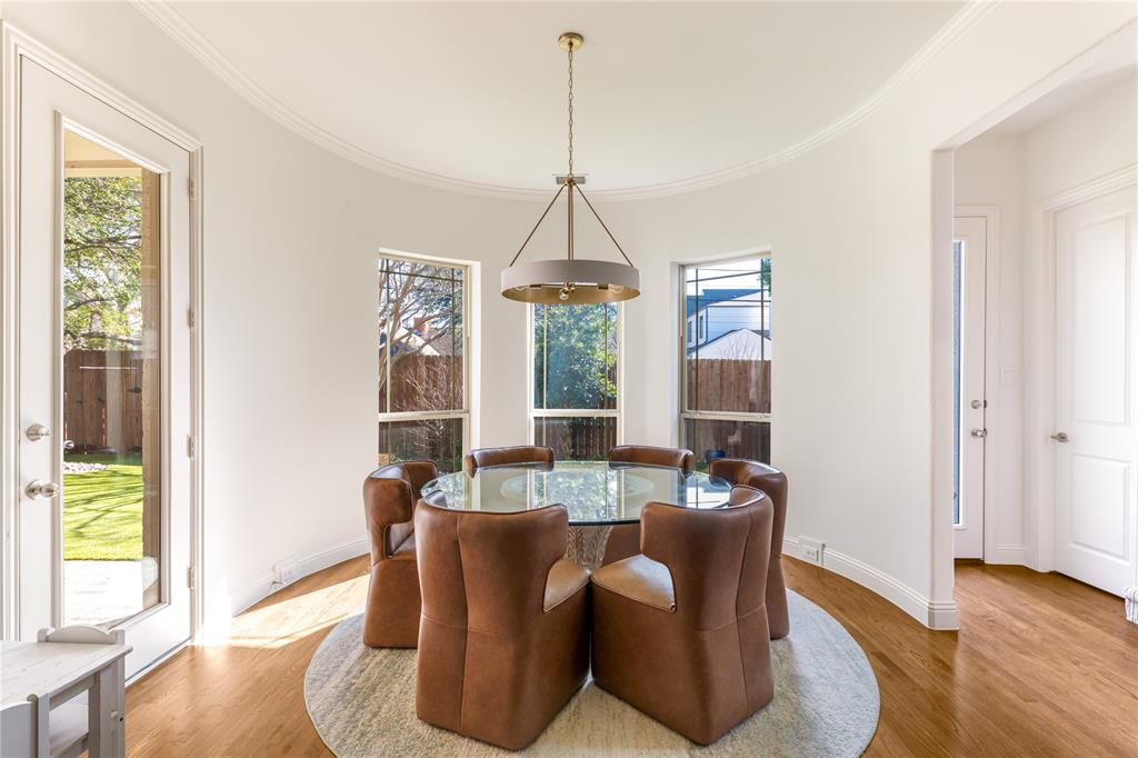 3914 Dunhaven Road Dallas, TX 75220 - Photo 12 of 21 a dining room with furniture a chandelier and wooden floor