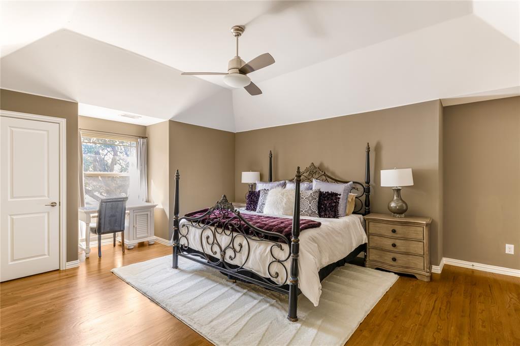 3914 Dunhaven Road Dallas, TX 75220 - Photo 17 of 21 a bedroom with a bed and wooden floor