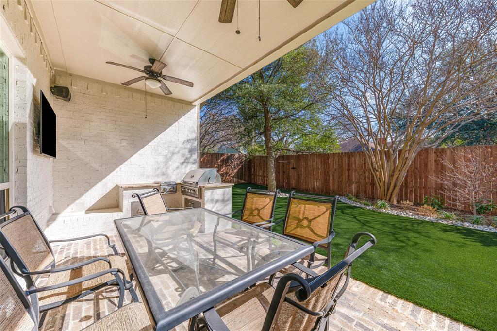 3914 Dunhaven Road Dallas, TX 75220 - Photo 20 of 21 a backyard of a house with table and chairs