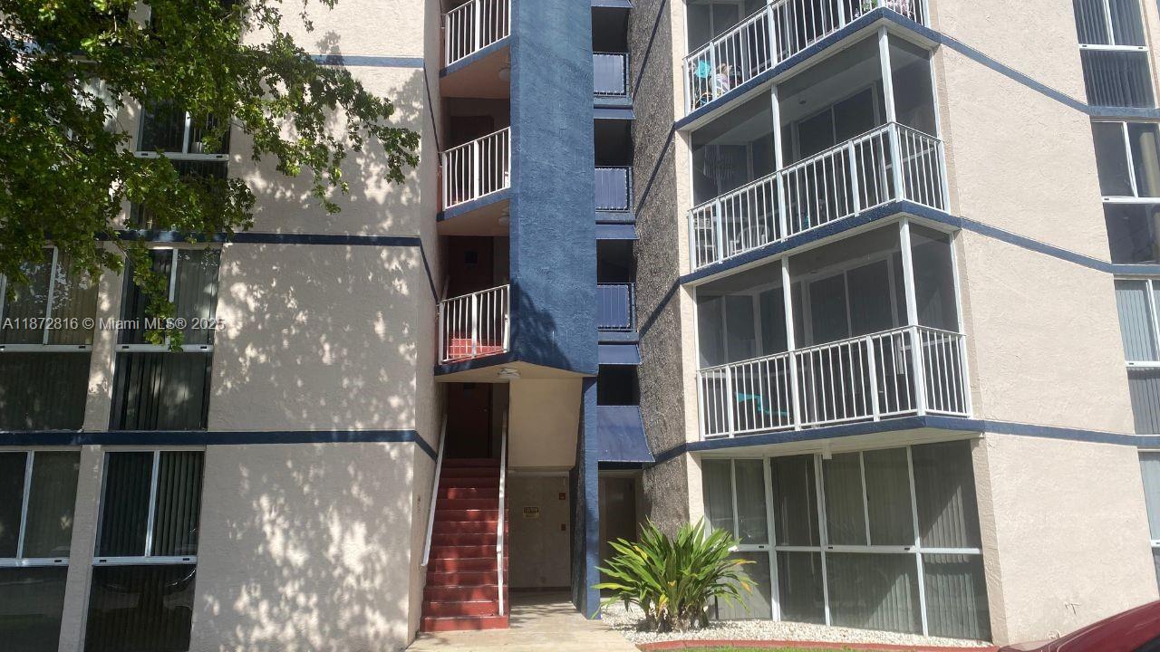 7075 Northwest 186th Street, Unit C110 Hialeah, FL 33015 - Photo 1 of 16 a view of a building from a window