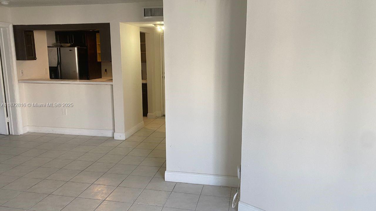 7075 Northwest 186th Street, Unit C110 Hialeah, FL 33015 - Photo 14 of 16 a view of a bathroom with a sink