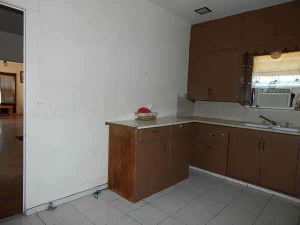 a kitchen with granite countertop cabinets and sink