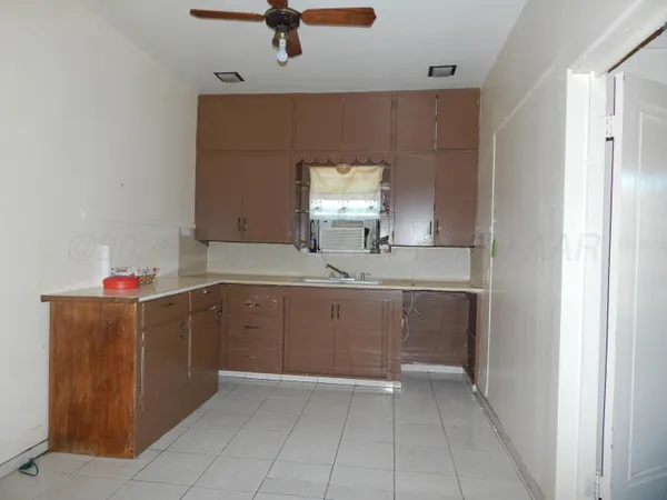 a bathroom with a sink a vanity and mirror