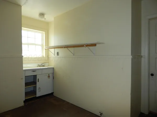 a bathroom with a sink and a window