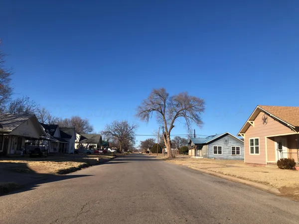 a view of multiple houses with a street