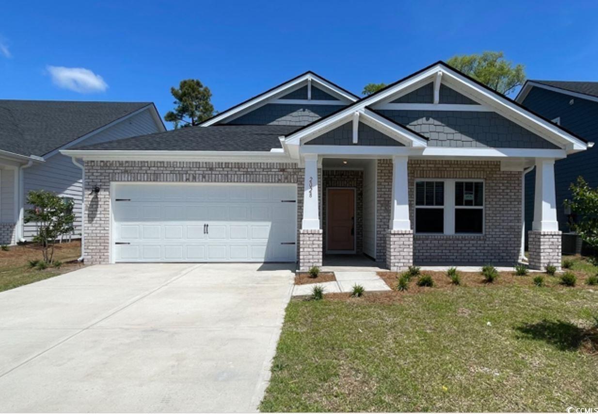 2028 Copper Crk Loop Longs, SC 29568 - Photo 1 of 16 Craftsman-style house with a garage, a front yard,