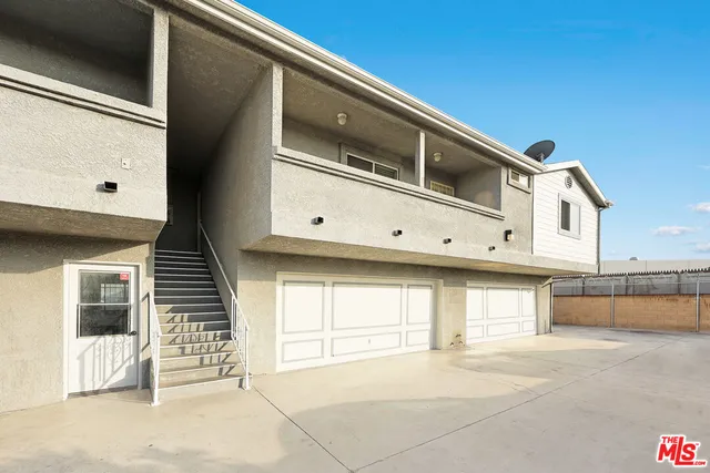 a view of a balcony with furniture