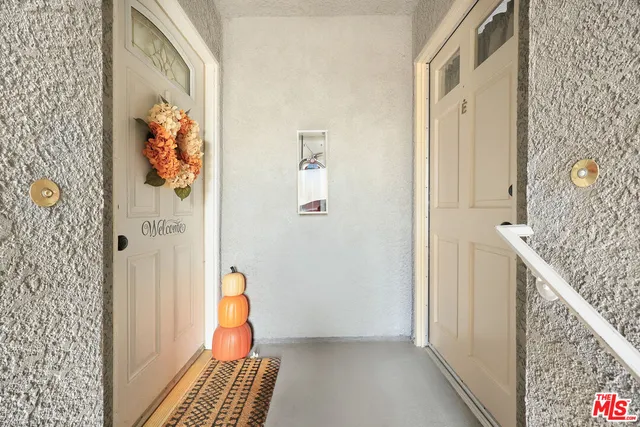 a view of a hallway with paintings on the wall