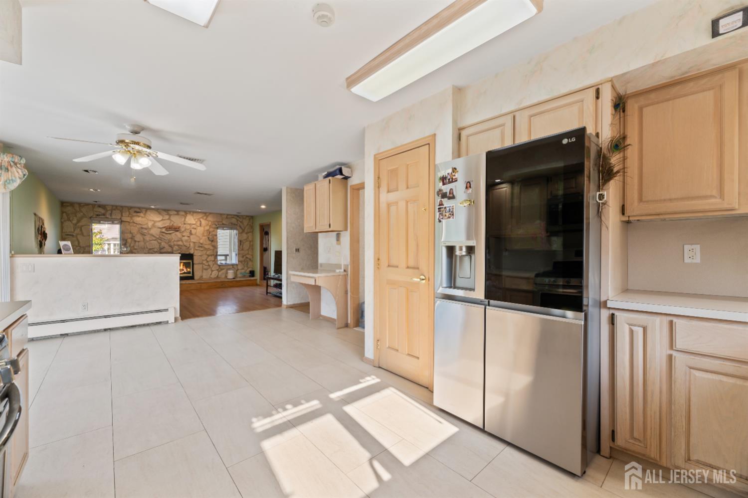 6 Allison Court Edison, NJ 08820 - Photo 11 of 53 a view of a kitchen with a refrigerator a microwave and a sink