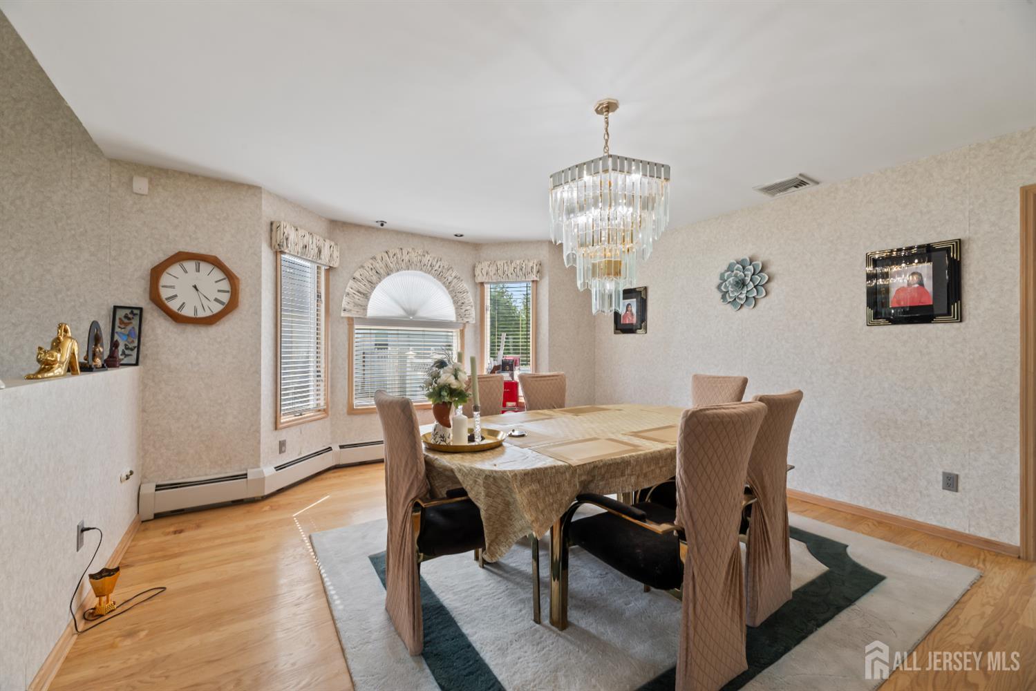 6 Allison Court Edison, NJ 08820 - Photo 15 of 53 a view of a dining room with furniture and a chandelier