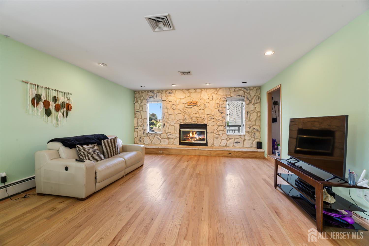 6 Allison Court Edison, NJ 08820 - Photo 16 of 53 a living room with furniture and a flat screen tv